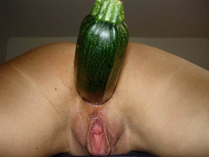 Girl with cucumber in the anus