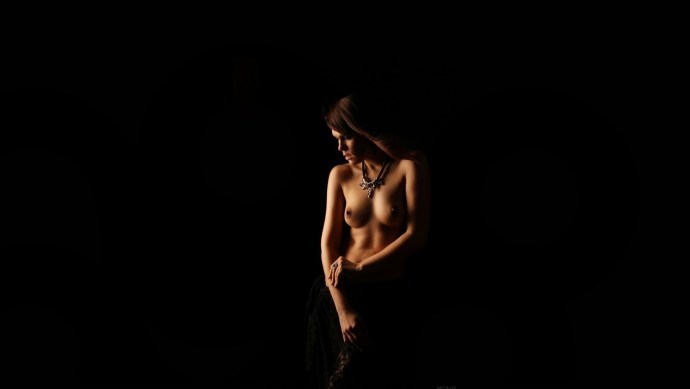Naked girls dark background