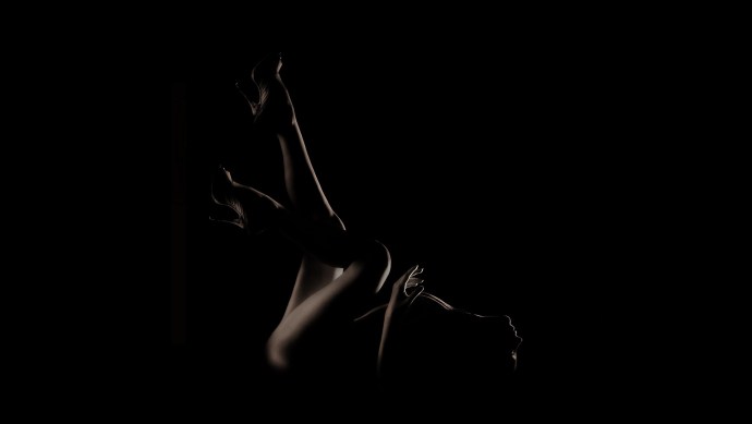 Female silhouette on a dark background