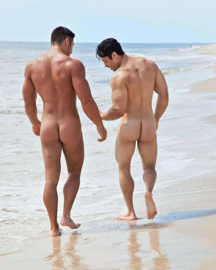 Naked men and women on the beach