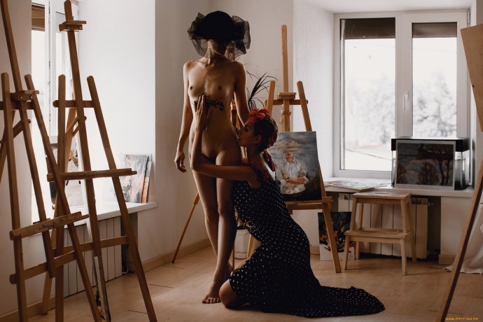 A naked man poses artists