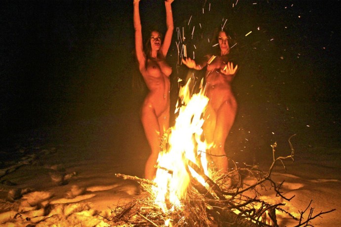 Naked girls by the fire