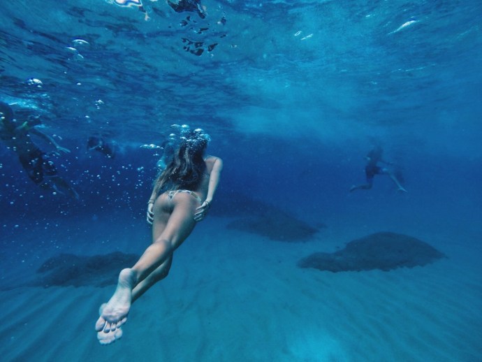 Girl swims under water