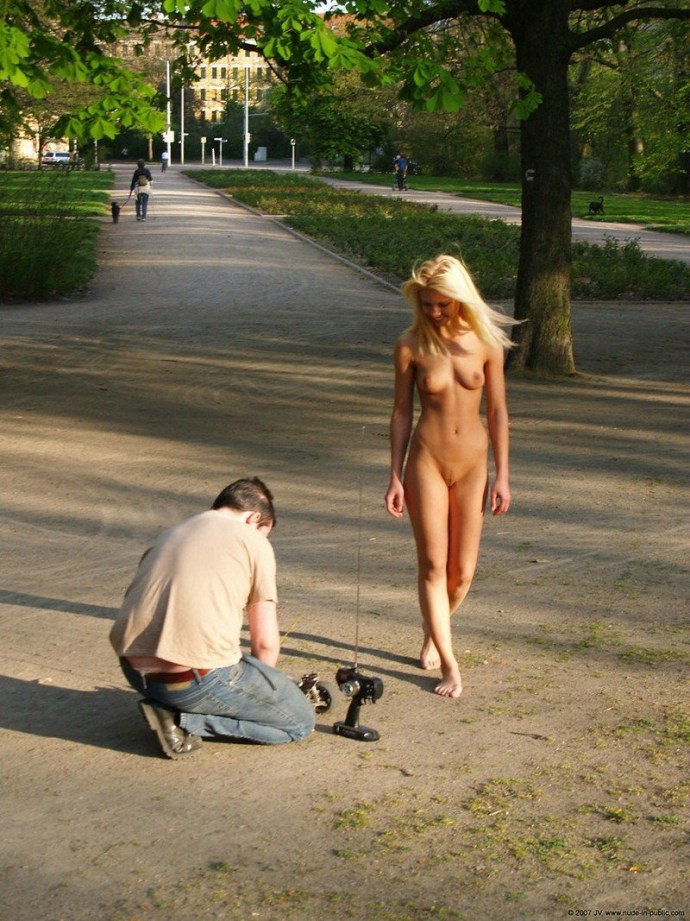 Naked woman walks along the street