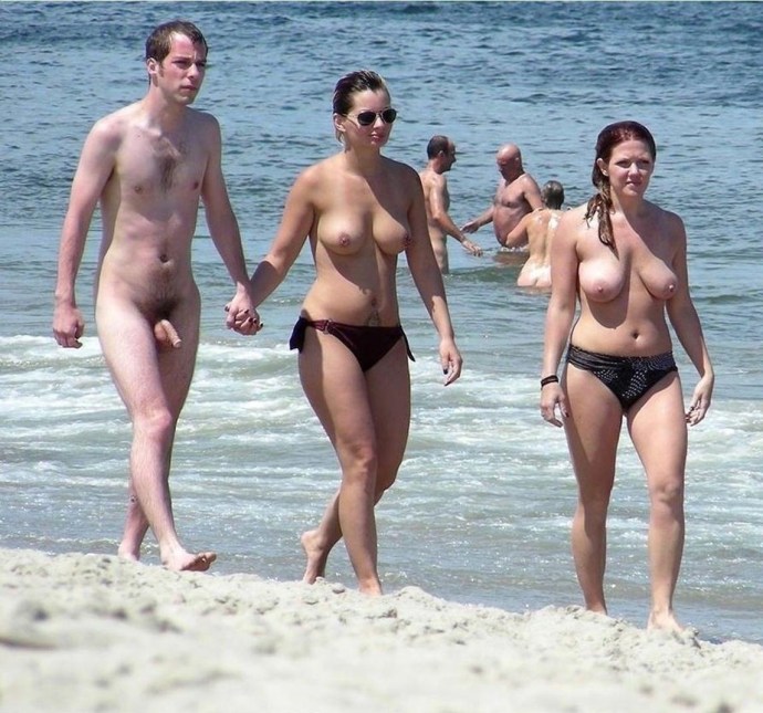 Dressed girls erection on the beach