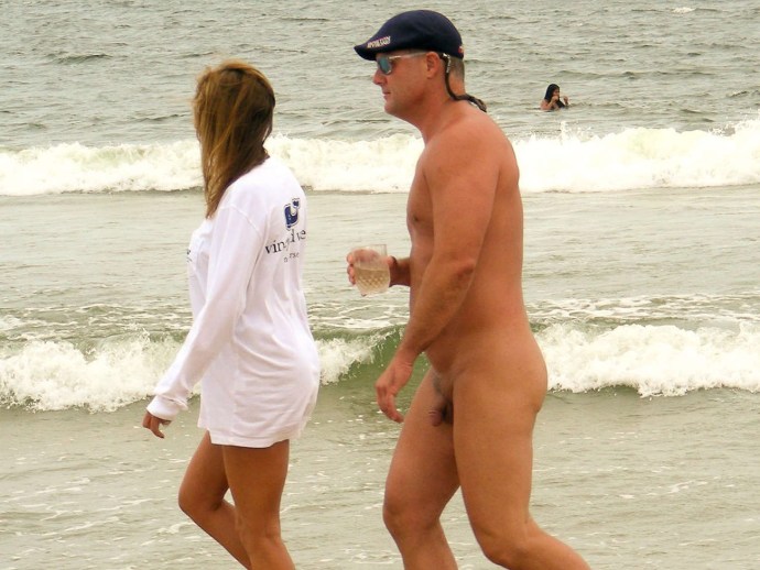 Naked guys on a regular beach