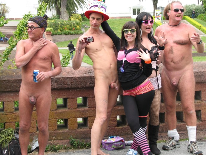 Naked guys on the beach among dressed
