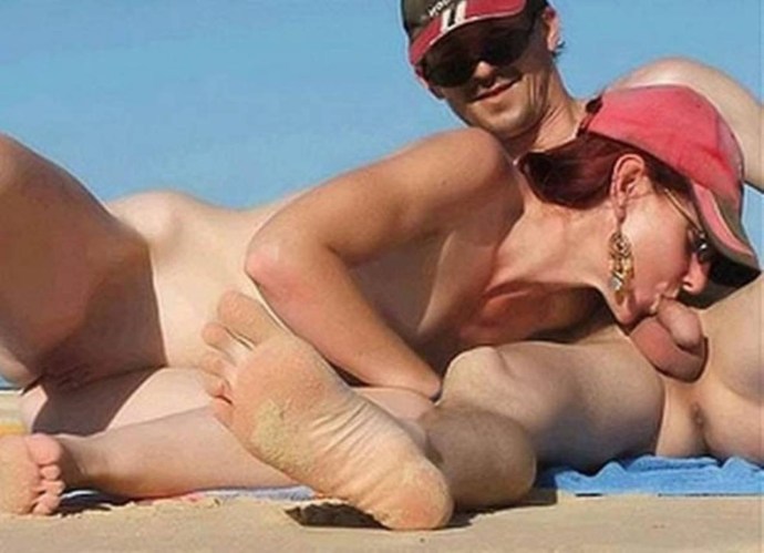 Naked pairs on the beach in public