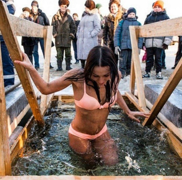 Girls bathe in the hole for baptism