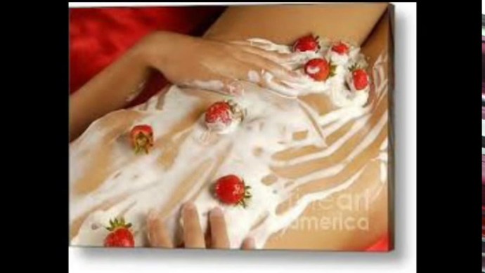 Cream with strawberries on a girl