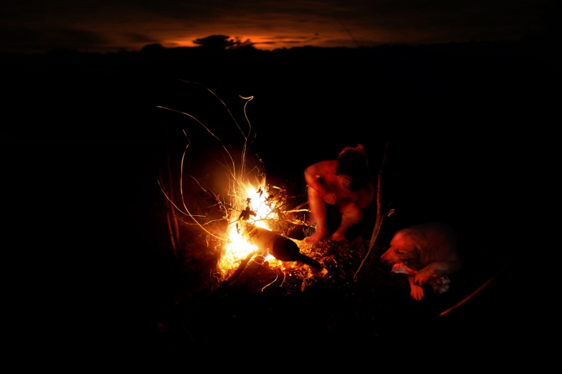 Naked men near the fire