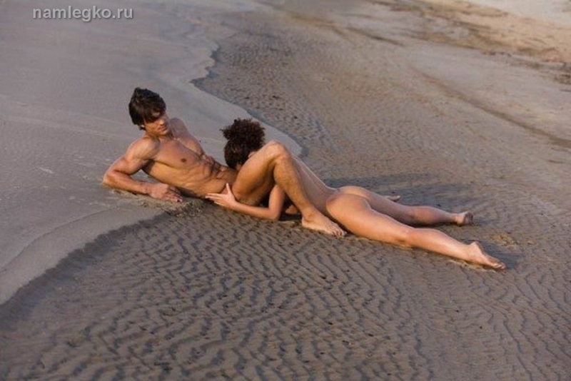Naked men and women on the beach