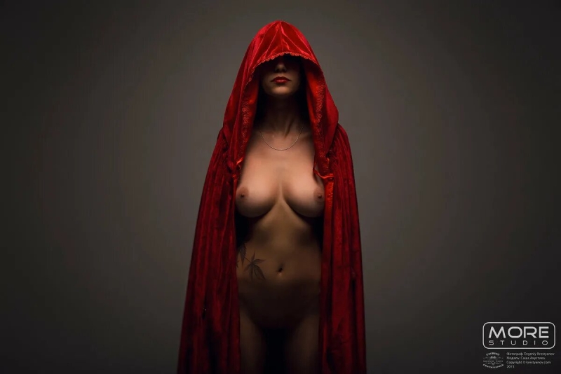 Naked woman in a red cloak