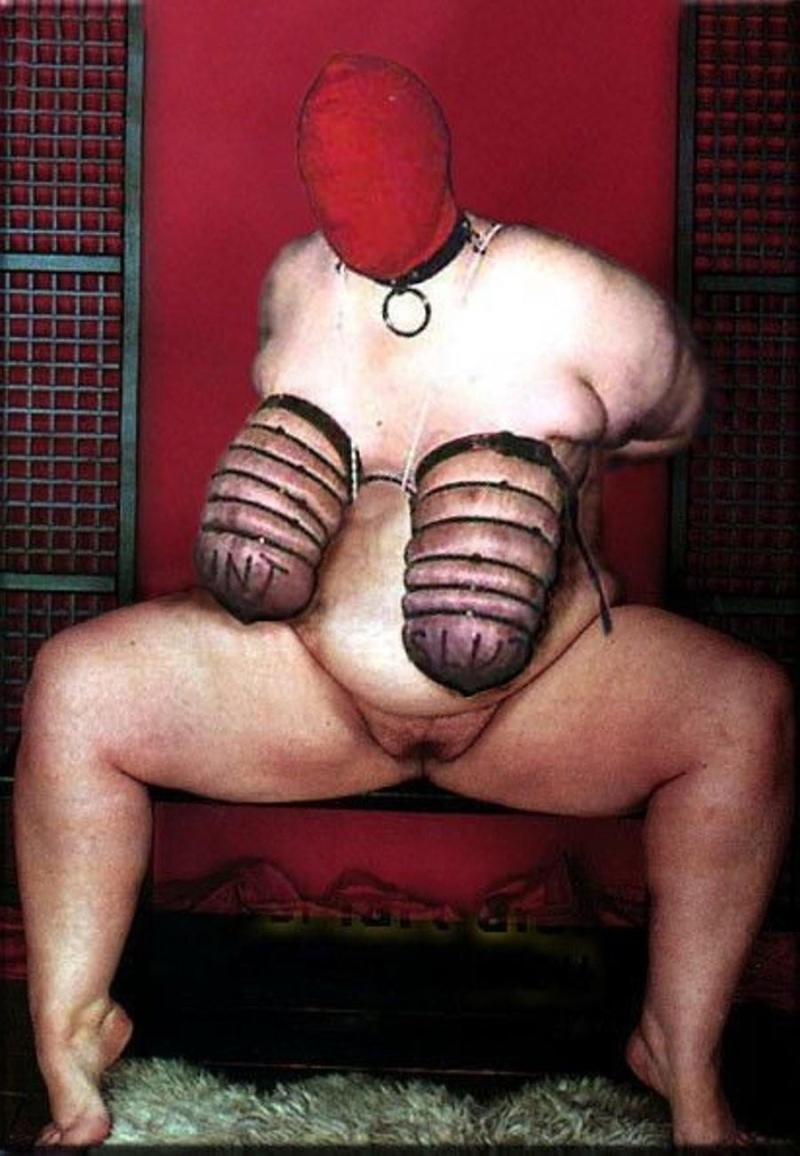 Fat man in the BDSM costume